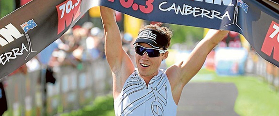 Tim Reed takes victory in the 2011 Ironman 70.3 Canberra
