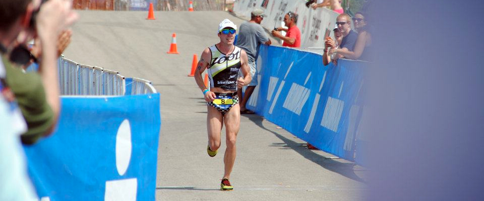 Tim Reed comes to the finish of the 2012 Racine 70.3