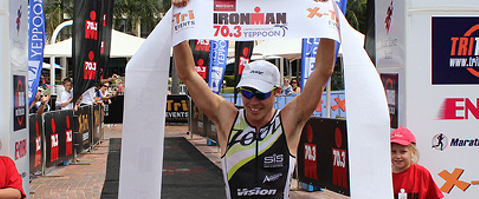 Tim Reed crosses the line as winner of the 2012 Yepoon 70.3 Ironman